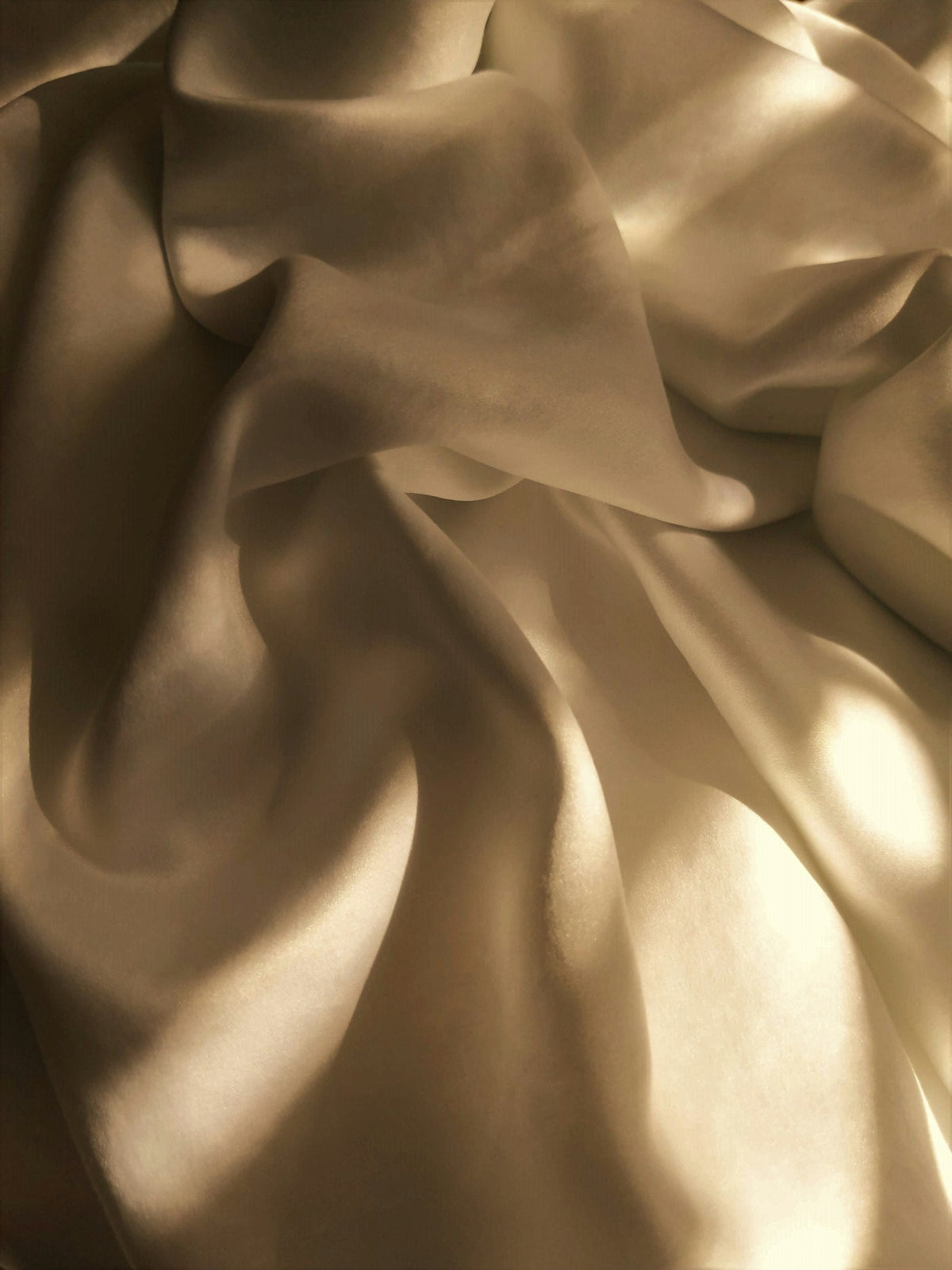 Soft white blanket on a bed