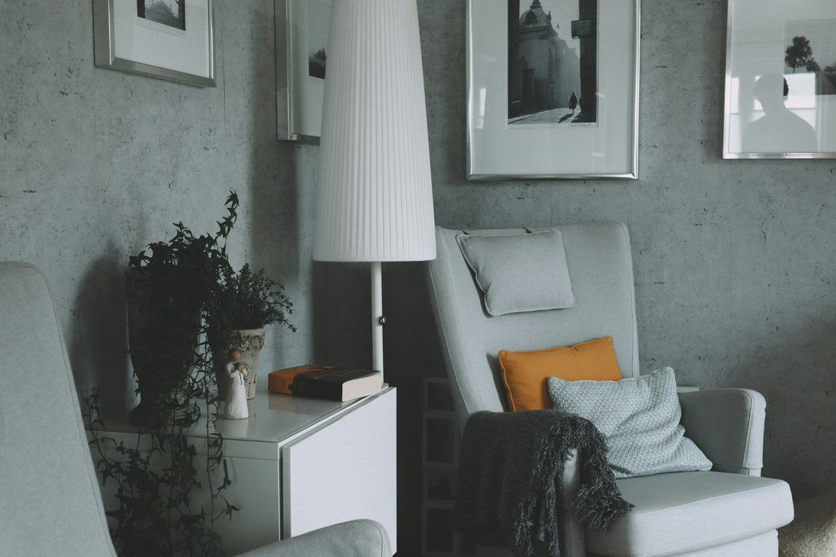 Cozy living room with a soft armchair and warm lamp light